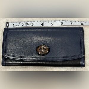 Coach wallet in navy blue and black.